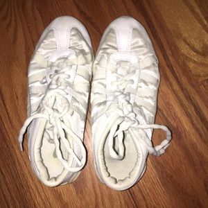 Four pairs of Infinity cheer shoes